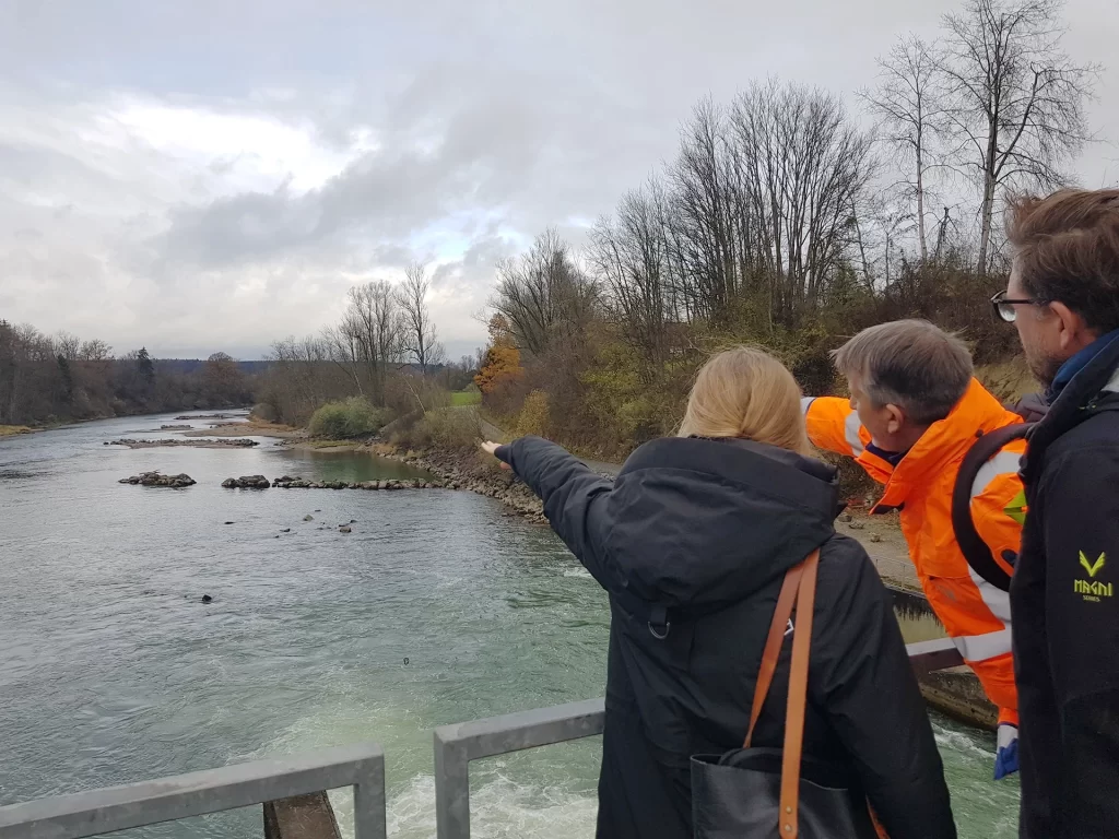 Partners from TUM at a dam on the River Iller